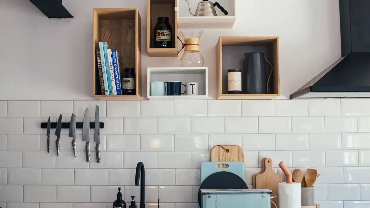 Wall-mounted storage boxes and magnetic knife rail for kitchen organization hacks