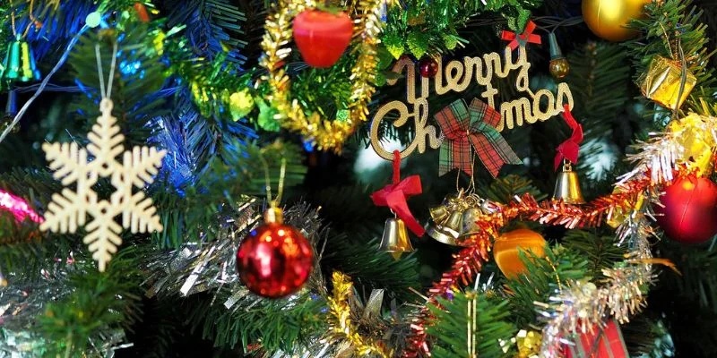 a close up of a christmas tree decorated with ornaments