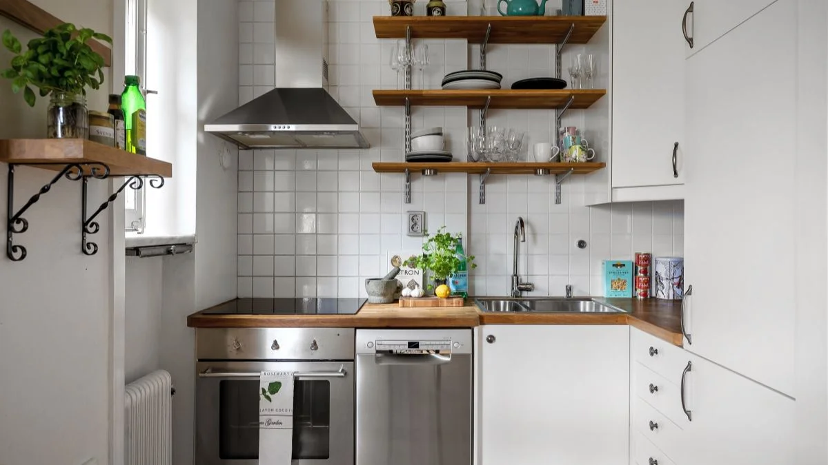 Small kitchen decor ideas with white cabinets, wood open shelving, and subway tile backsplash