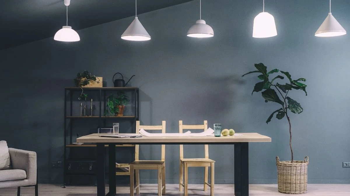 Row of pendant lights hanging over a dining table a lighting idea for adding height to a room