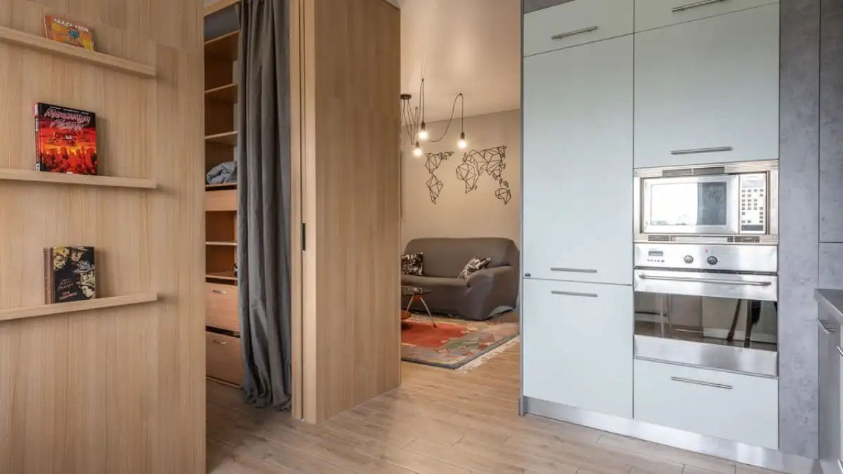small space home decor ideas with built-in wooden storage in a studio apartment